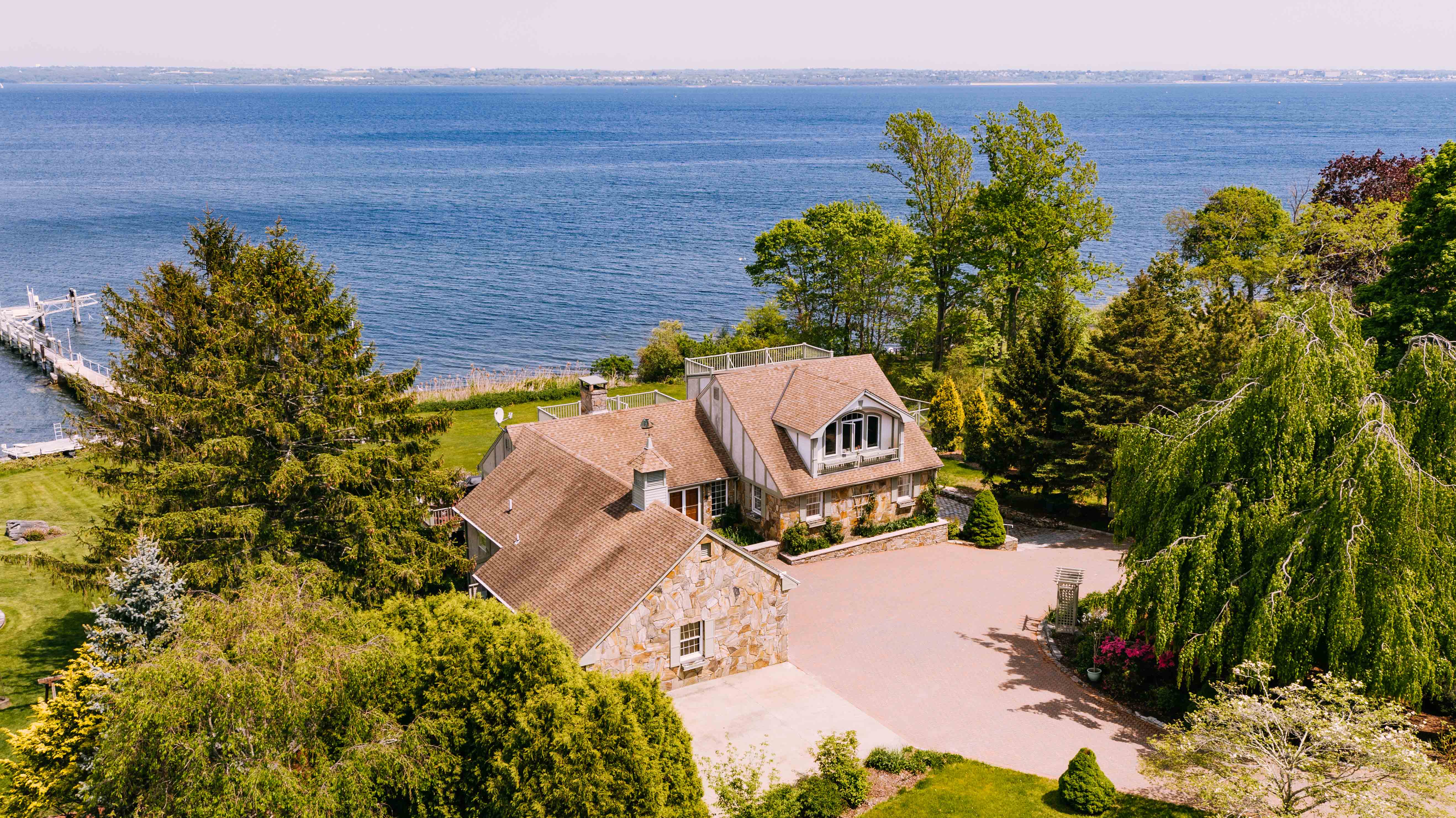 WATERFRONT CONTEMPORARY TUDOR ON JAMESTOWN’S EAST SHORE ROAD SELLS FOR $2.35M